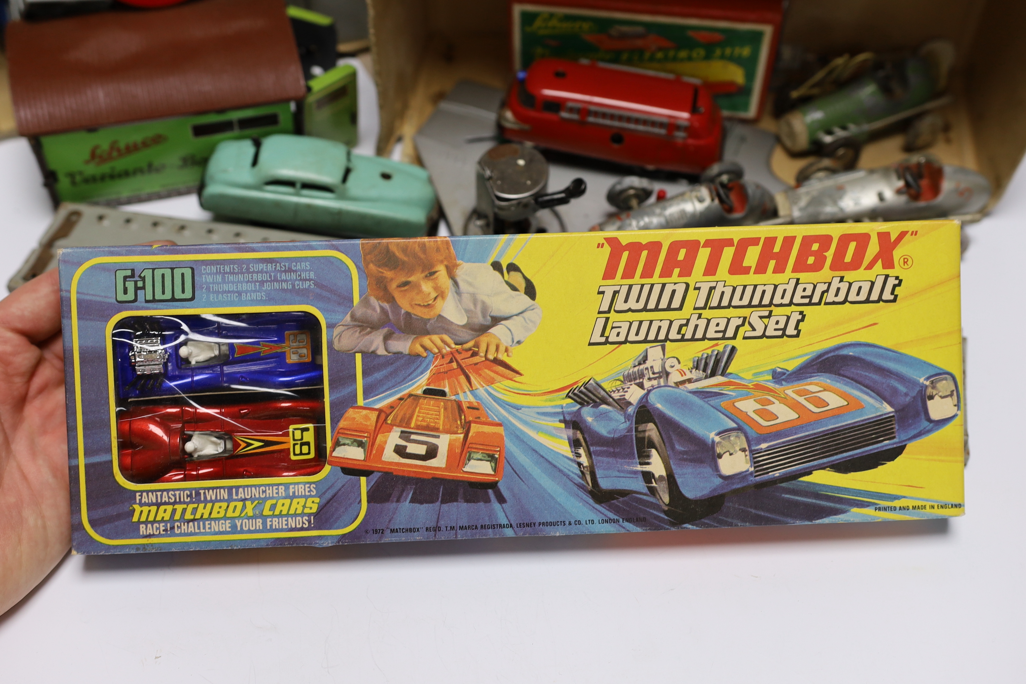 A boxed Matchbox Twin Thunderbolt Launcher set G-100, together with a quantity of Schuco Varianto items including four vehicles; a Varianto-Limo (3041), a Shell tanker, a fire engine, a pickup truck, garage, tunnel, trac